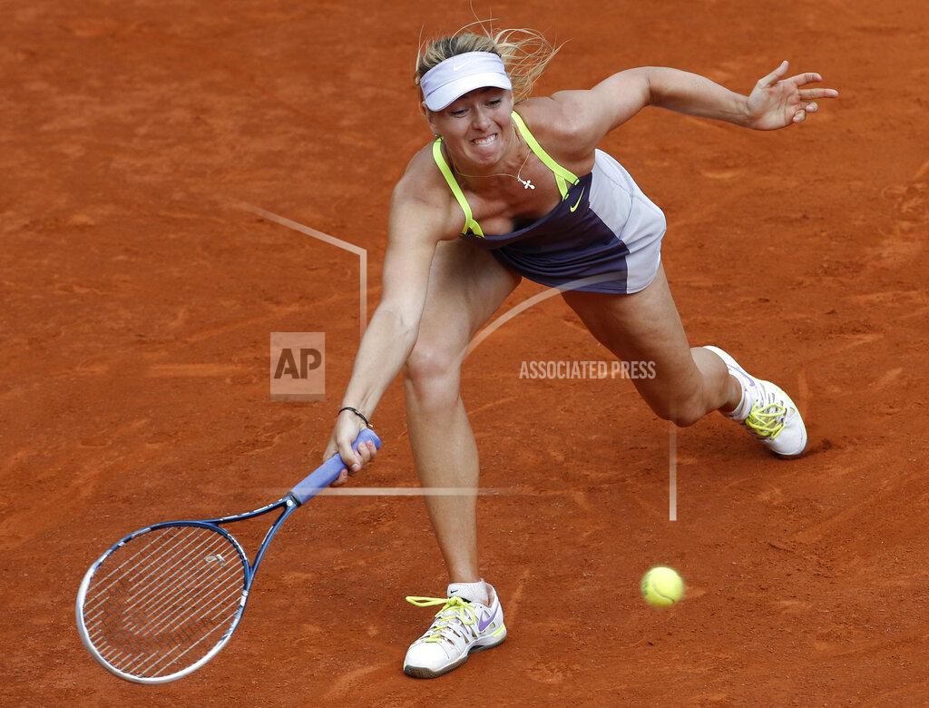 Christophe Ena FILE- In this Thursday, June 6, 2019, image, Russia's Maria Sharapova returns the ball to Belarus' Victoria Azarenka during their semifinal match of the French Open tennis tournament at the Roland Garros stadium in Paris. The skill of sliding at Roland Garros is on hold at the moment with the start of the French Open postponed until September because of the coronavirus, and Sharapova once joked that the slippery clay made her look like "a cow on ice." but sliding is one of the keys to success at the French Open. (AP Photo/Christophe Ena, File)