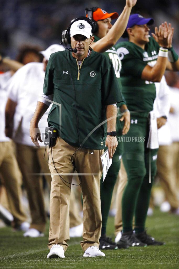David Zalubowski FILE - In this Friday, Aug. 31, 2018, file photo, Colorado State coach Mike Bobo walks the sideline during the second half of the team's NCAA college football game against Colorado in Denver. Bobo preaches toughness and accountability. He demonstrated that toughness last season by walking the sidelined despite fighting a rare autoimmune disease that caused him to lose sensation in both feet. He showed accountability by declining a $100,000 pay increase due to him after the Rams struggled to a 3-9 record in 2018. That's why his messages hit home. (AP Photo/David Zalubowski, File)
