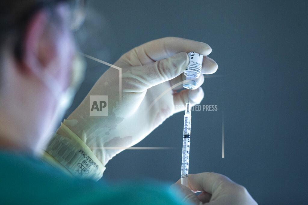 Joseph Cress A vial of the Pfizer-BioNTech COVID-19 vaccine is drawn into a syringe, Monday, Dec. 14, 2020, on the 12th floor of the University of Iowa Stead Family Children's Hospital in Iowa City, Iowa. (Joseph Cress/Iowa City Press-Citizen via AP)
