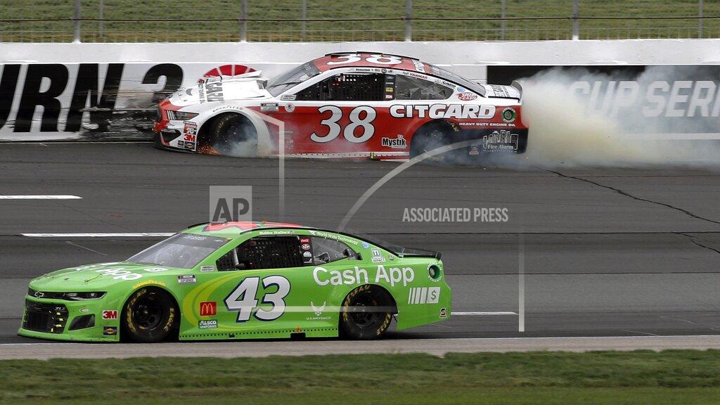 Charles Krupa Driver John Hunter Nemechek (38) bangs into the wall after losing a tire as Bubba Wallace (43) passes safely below during a NASCAR Cup Series auto race, Sunday, Aug. 2, 2020, at the New Hampshire Motor Speedway in Loudon, N.H. (AP Photo/Charles Krupa)