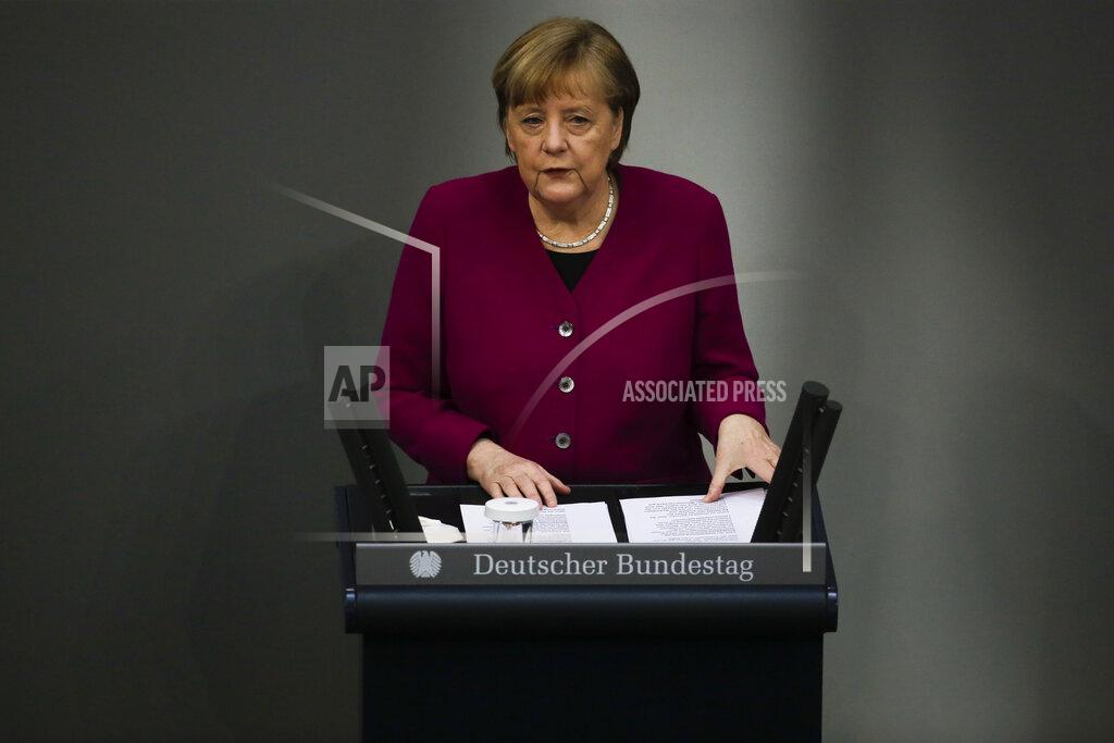 Markus Schreiber German Chancellor Angela Merkel addresses the German parliament Bundestag ahead of an European Union summit at the Reichstag building in Berlin, Germany, Thursday, March 25, 2021. (AP Photo/Markus Schreiber)