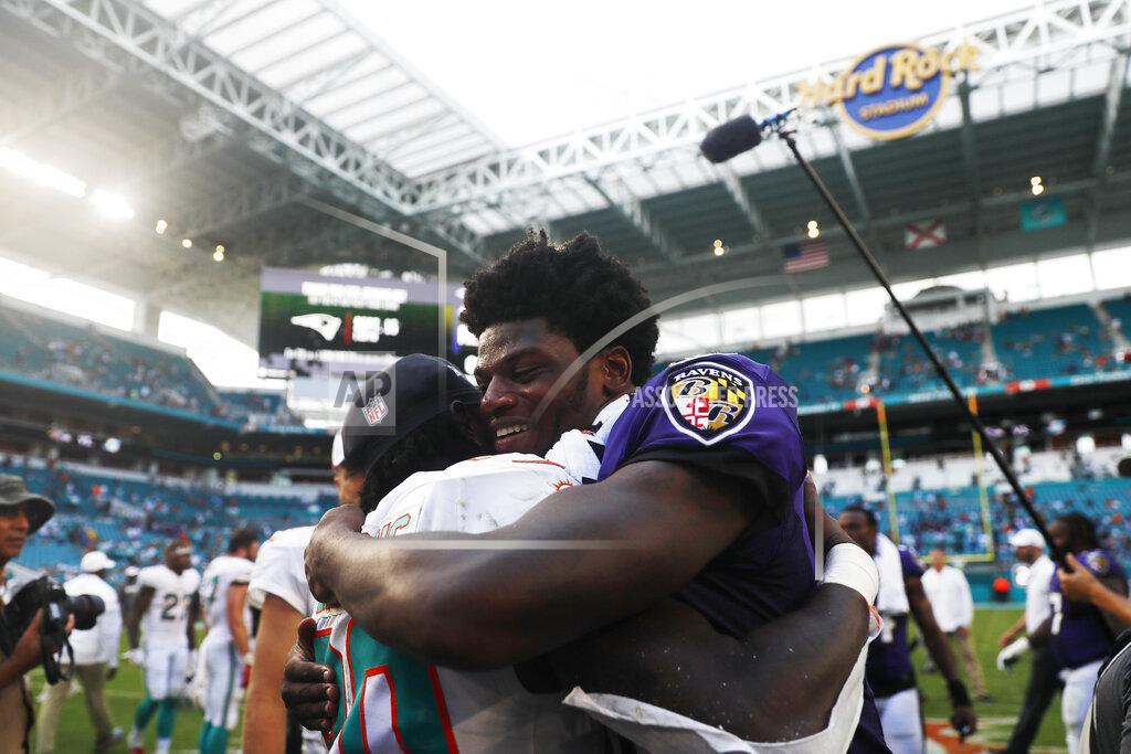 Brynn Anderson Baltimore Ravens quarterback Lamar Jackson (8) hugs Miami Dolphins defensive back Chris Lammons (30) at the end of an NFL football game, Sunday, Sept. 8, 2019, in Miami Gardens, Fla. The Ravens defeated the Dolphins 59-10. (AP Photo/Brynn Anderson)