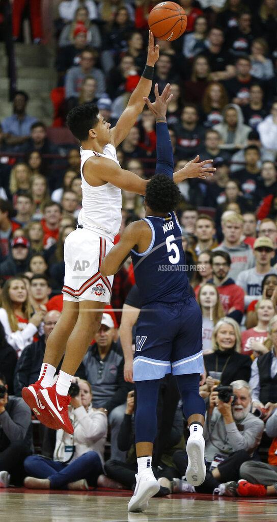 Jay Laprete Ohio State's D.J. Carton, left, shoots over Villanova's Justin Moore during the first half of an NCAA college basketball game Wednesday, Nov. 13, 2019, in Columbus, Ohio. (AP Photo/Jay LaPrete)