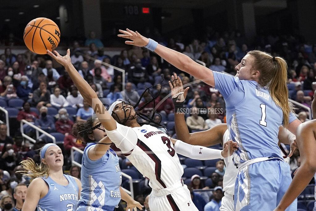 Gerry Broome South Carolina guard Destanni Henderson (3) shoots while North Carolina guard Alyssa Ustby (1) defends during the second half of a college basketball game in the Sweet 16 round of the NCAA tournament in Greensboro, N.C., Friday, March 25, 2022. (AP Photo/Gerry Broome)