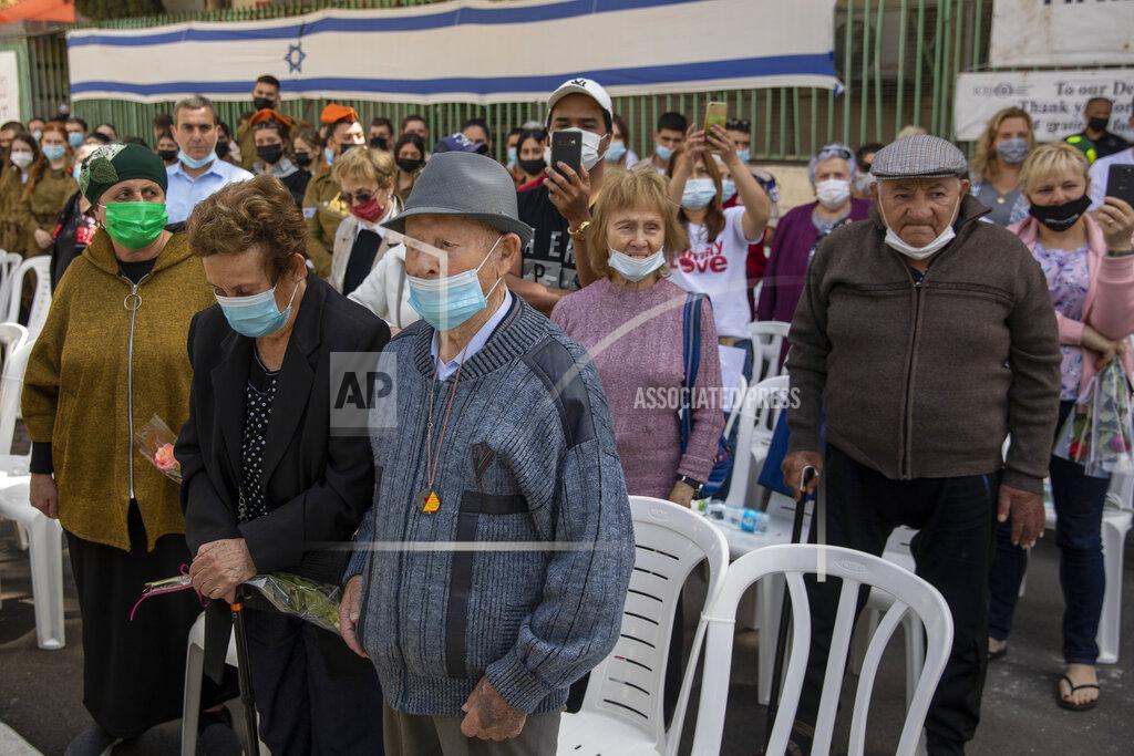 Ariel Schalit Holocaust survivors wearing face masks amid the coronavirus attend the yearly Holocaust Remembrance Day ceremony in Haifa, Israel, Thursday, April 8, 2021. (AP Photo/Ariel Schalit)
