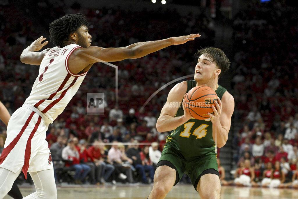 Michael Woods North Dakota State guard Boden Skunberg (14) looks to shoot over Arkansas guard Ricky Council IV (1) during the first half of an NCAA college basketball game Monday, Nov. 7, 2022, in Fayetteville, Ark. (AP Photo/Michael Woods)