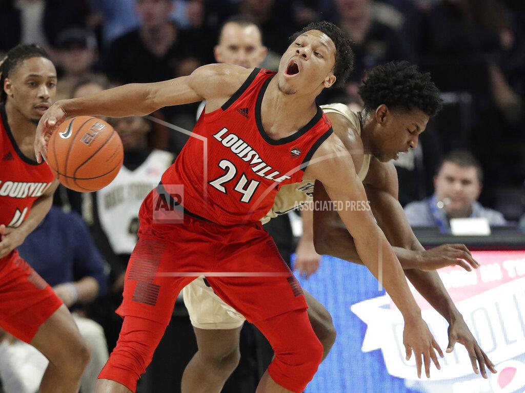 Chuck Burton Louisville's Dwayne Sutton (24) is fouled by Wake Forest's Jaylen Hoard, right, during the first half of an NCAA college basketball game in Winston-Salem, N.C., Wednesday, Jan. 30, 2019. (AP Photo/Chuck Burton)