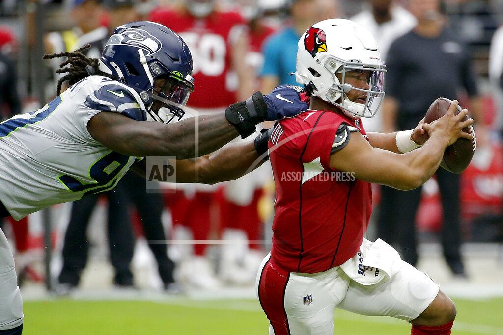 Rick Scuteri Arizona Cardinals quarterback Kyler Murray (1) eludes the reach of Seattle Seahawks outside linebacker Jadeveon Clowney (90) during the first half of an NFL football game, Sunday, Sept. 29, 2019, in Glendale, Ariz. (AP Photo/Rick Scuteri)