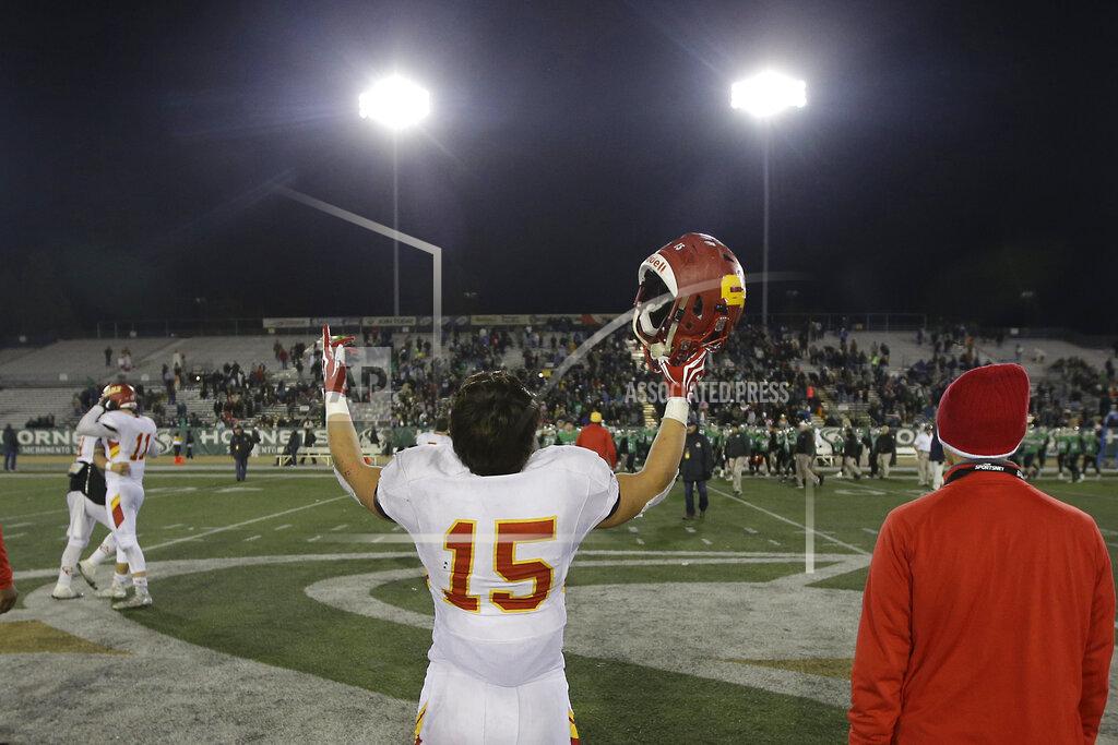 Rich Pedroncelli FILE - In this Friday, Dec. 16, 2016, file photo, Cathedral Catholic running back Shawn Poma celebrates after the Dons beat the St. Mary's Rams 38-35, in overtime of the Division 1AA high school football championship game in Sacramento, Calif. The California Interscholastic Federation, California's governing body for high school sports, said Monday, July 20, 2020 that the 2020-21 sports seasons will begin no earlier than December due to the coronavirus pandemic. The CIF said the normal fall, winter and spring sports seasons will be condensed into two seasons. (AP Photo/Rich Pedroncelli, File)
