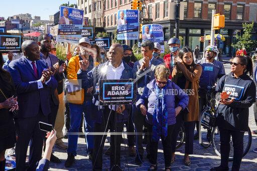 Eric Adams, Democrat candidate for New York Mayor, center, speaks during a campaign event, Tuesday, Oct. 19, 2021, in New York. (AP Photo/Mary Altaffer)