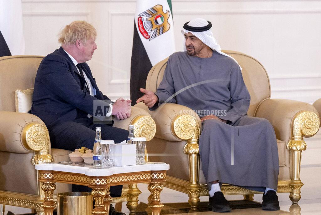 Abdulla Al Junaibi This photo made available by Ministry of Presidential Affairs shows, British Prime Minister Boris Johnson, left, offers his condolences to Sheikh Mohammed bin Zayed Al Nahyan, President of the UAE and Ruler of Abu Dhabi, on the passing of Sheikh Khalifa bin Zayed Al Nahyan, late President of the UAE, in Abu Dhabi, UAE, Sunday, May 15, 2022. (Abdulla Al Junaibi/Ministry of Presidential Affairs via AP)