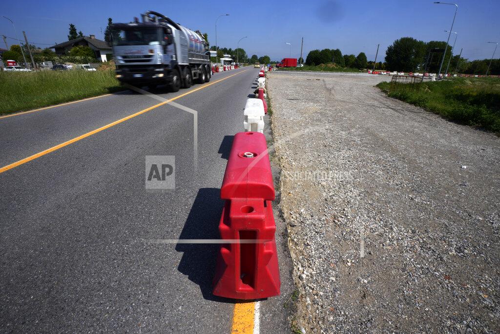 Antonio Calanni A truck passes on a road under construction in Caponago, near Milan, Italy, Thursday, May 12, 2022. Russia's war in Ukraine has accelerated inflation across Europe, with prices for energy, materials and food surging at rates not seen for decades. Inflation is expected to hit nearly 7% this year in the 27-nation EU and is contributing to slowing growth forecasts. (AP Photo/Antonio Calanni)