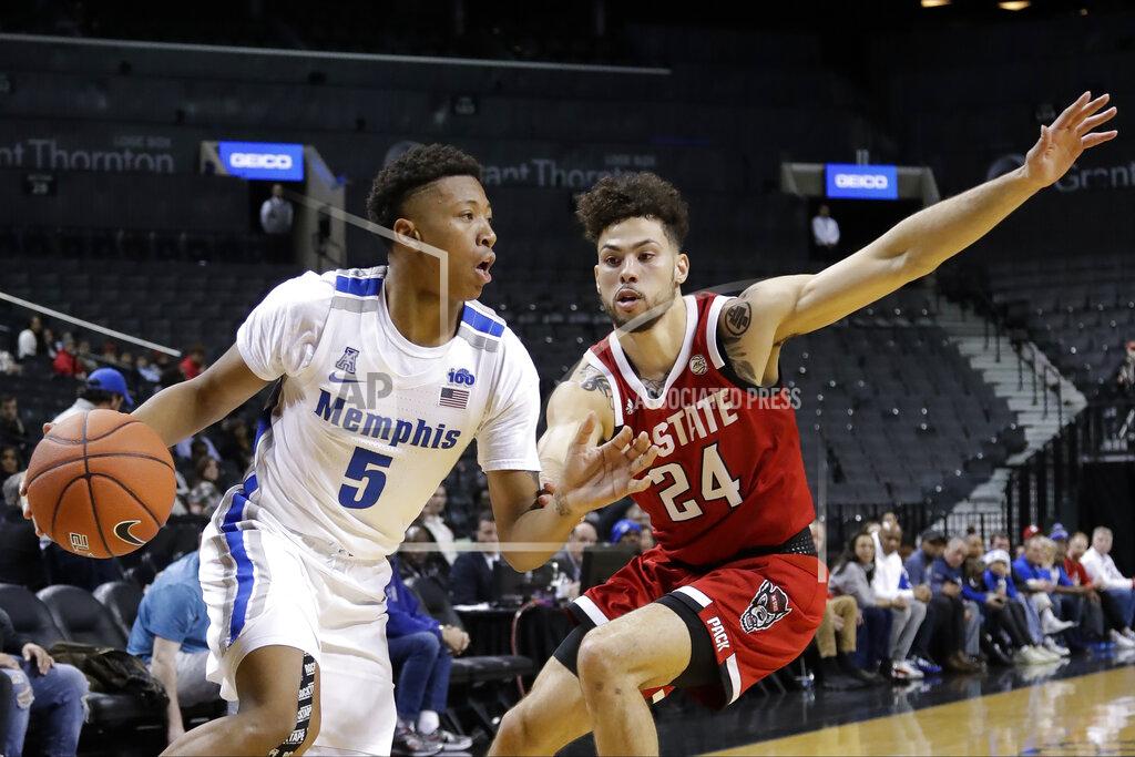 Frank Franklin Ii Memphis' Boogie Ellis (5) drives past North Carolina State's Devon Daniels (24) during the first half of an NCAA college basketball game in the Barclays Classic, Thursday, Nov. 28, 2019, in New York. (AP Photo/Frank Franklin II)