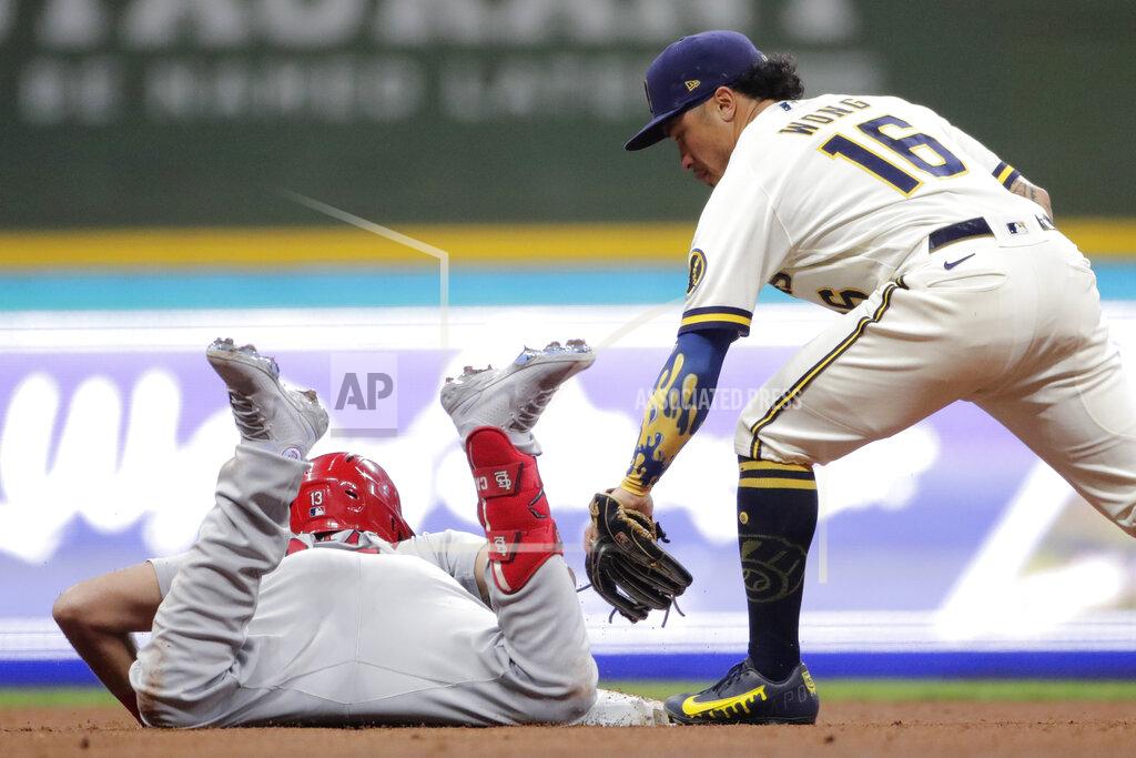 Aaron Gash St. Louis Cardinals' Matt Carpenter, left, slides safely into second base for a double past the tag of Milwaukee Brewers' Kolten Wong (16) during the seventh inning of a baseball game Monday, Sept. 20, 2021, in Milwaukee. (AP Photo/Aaron Gash)