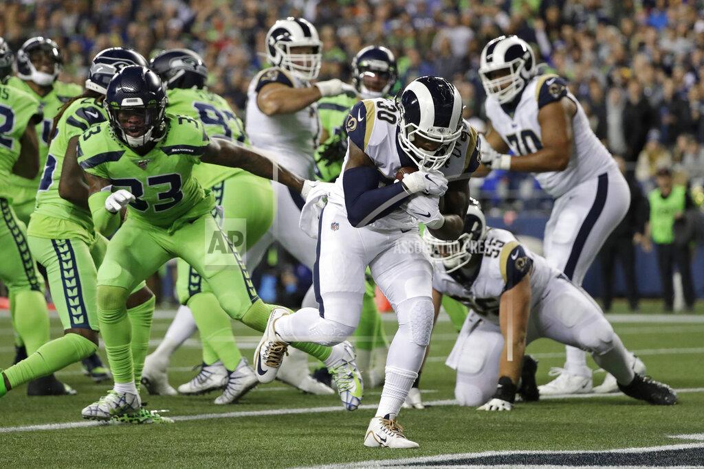 Elaine Thompson Los Angeles Rams running back Todd Gurley, front, rushes for a touchdown against the Seattle Seahawks during the second half of an NFL football game Thursday, Oct. 3, 2019, in Seattle. (AP Photo/Elaine Thompson)