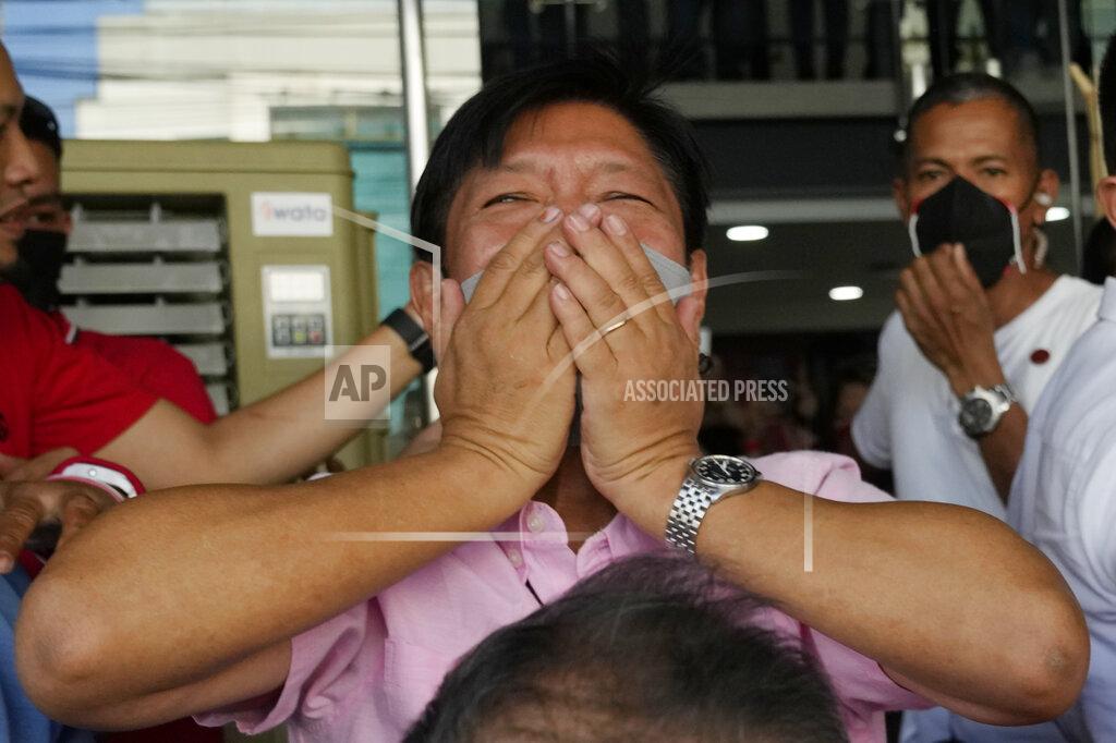 Aaron Favila Presidential candidate Ferdinand "Bongbong" Marcos Jr. gestures as he greets the crowd outside his headquarters in Mandaluyong, Philippines on Wednesday, May 11, 2022. Marcos' apparent landslide victory in the Philippine presidential election is raising immediate concerns about a further erosion of democracy in Asia and could complicate American efforts to blunt growing Chinese influence and power in the Pacific. (AP Photo/Aaron Favila)