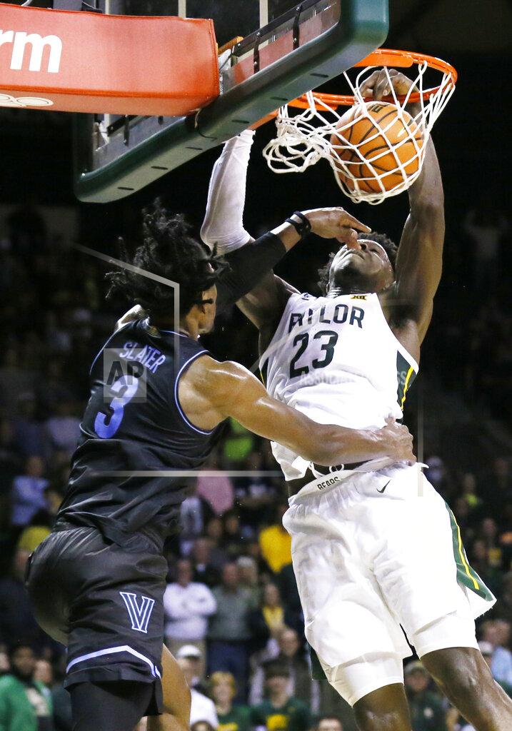 Ray Carlin Baylor forward Jonathan Tchamwa Tchatchoua (23) goes up for the dunk as Villanova forward Brandon Slater (3) defends during the second half of an NCAA college basketball game on Sunday, Dec. 12, 2021, in Waco, Texas. (AP Photo/Ray Carlin)