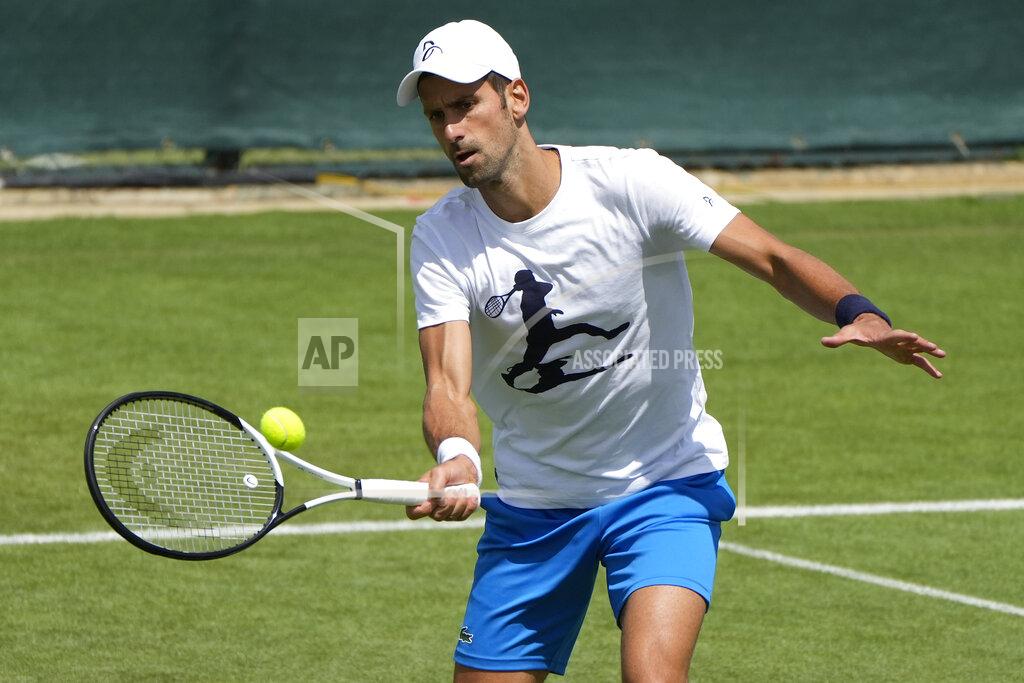 Alastair Grant Serbia's Novak Djokovic plays a return as he practices ahead of the Wimbledon tennis championships in London, Sunday, June 26, 2022. (AP Photo/Alastair Grant)