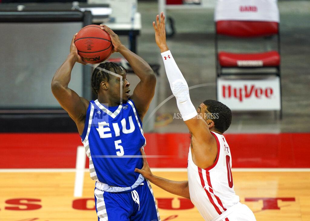 Andy Manis Eastern Illinois' Junior Farquhar (5) looks to pass against Wisconsin's D'Mitrik Trice (0) during the first half of an NCAA college basketball game, Wednesday, Nov. 25, 2020, in Madison, Wis. (AP Photo/Andy Manis)