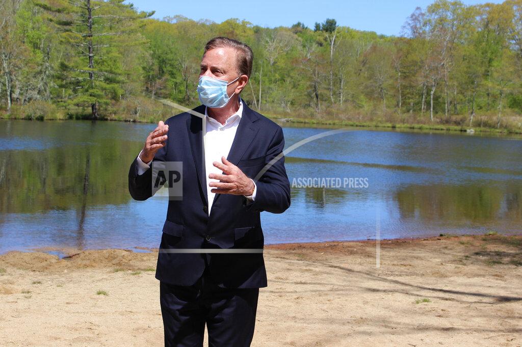 Connecticut Gov. Ned Lamont speaks to reporters at Gay City State Park in Hebron, Conn. on Thursday May 21, 2020. The governor held his daily COVID-19 briefing for the media at the park in advance of the Memorial Day weekend. (AP Photo/Pat Eaton-Robb)