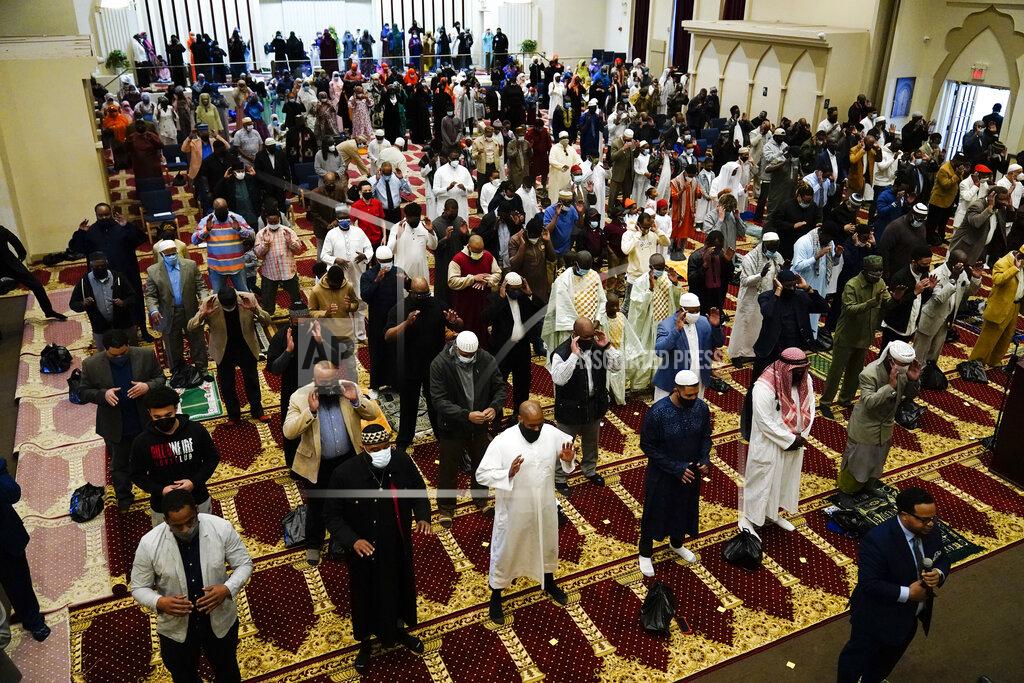 Matt Rourke Worshippers perform an Eid al-Fitr prayer at the Masjidullah Mosque in Philadelphia, Thursday, May 13, 2021. Millions of Muslims across the world are marking the holiday of Eid al-Fitr, the end of the fasting month of Ramadan. (AP Photo/Matt Rourke)