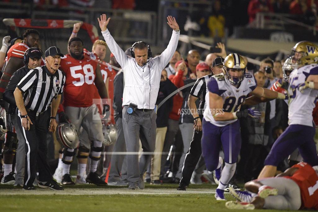 Mark J. Terrill Ohio State coach Urban Meyer celebrates at the team's 28-23 win over Washington during the Rose Bowl NCAA college football game Tuesday, Jan. 1, 2019, in Pasadena, Calif. (AP Photo/Mark J. Terrill)