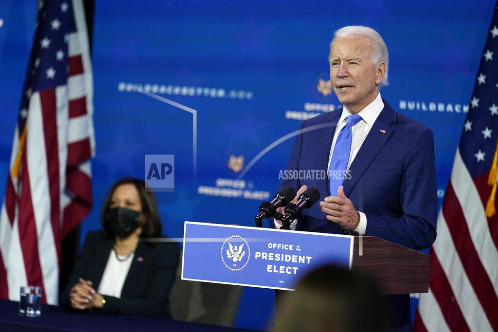 In this Dec. 1, 2020, photo, President-elect Joe Biden speaks as Vice President-elect Kamala Harris listens at left, during an event to introduce their nominees and appointees to economic policy posts at The Queen theater in Wilmington, Del. Up soon for Biden: naming his top health care officials as the coronavirus pandemic rages. It’s hard to imagine more consequential picks. Biden is expected to announce his choice to head the Department of Health and Human Services next week. (AP Photo/Andrew Harnik)