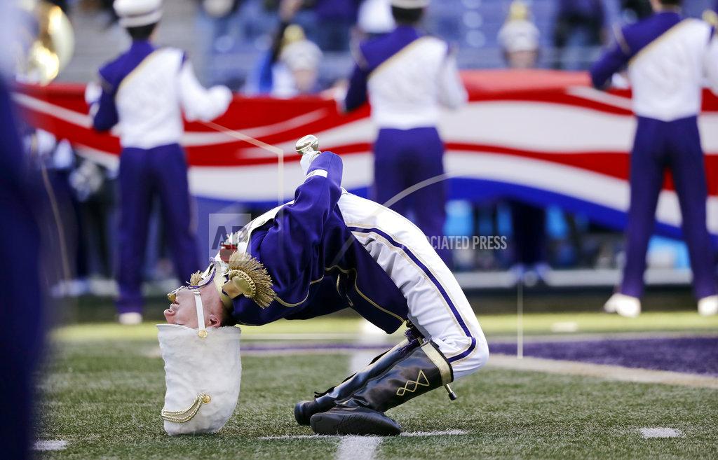 Elaine Thompson Washington Husky Marching Band drum major Zach Baisch bends backward during the playing of the national anthem before an NCAA college football game against Oregon State, Saturday, Nov. 17, 2018, in Seattle. (AP Photo/Elaine Thompson)