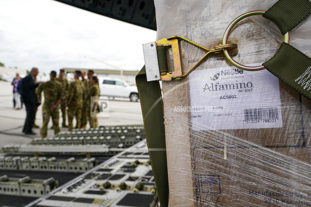 Michael Conroy Agriculture Secretary Tom Vilsack, left, greets crew members of a C-17 that delivered a plane load of baby formula at the Indianapolis International Airport in Indianapolis, Sunday, May 22, 2022. The 132 pallets of Nestlé Health Science Alfamino Infant and Alfamino Junior formula arrived from Ramstein Air Base in Germany (AP Photo/Michael Conroy)
