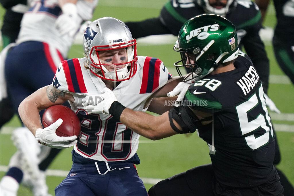 Corey Sipkin New England Patriots' Gunner Olszewski, left, tries to fend off New York Jets Bryce Hagar during the second half of an NFL football game, Monday, Nov. 9, 2020, in East Rutherford, N.J. (AP Photo/Corey Sipkin)