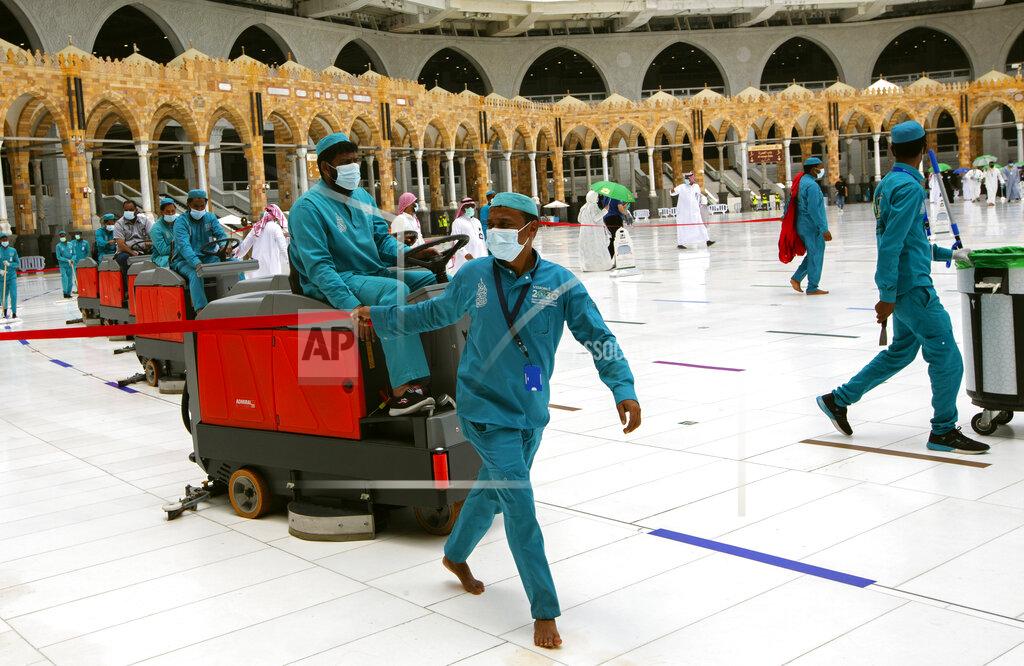 Amr Nabil Workers disinfect the grounds at the Grand Mosque to help protect against the coronavirus in the Muslim holy city of Mecca, Saudi Arabia, Thursday, July 22, 2021. The virus has taken its toll on the annual hajj for a second year running. What once drew some 2.5 million Muslims from all walks of life from across the globe, the hajj pilgrimage is now almost unrecognizable in scale. (AP Photo/Amr Nabil)
