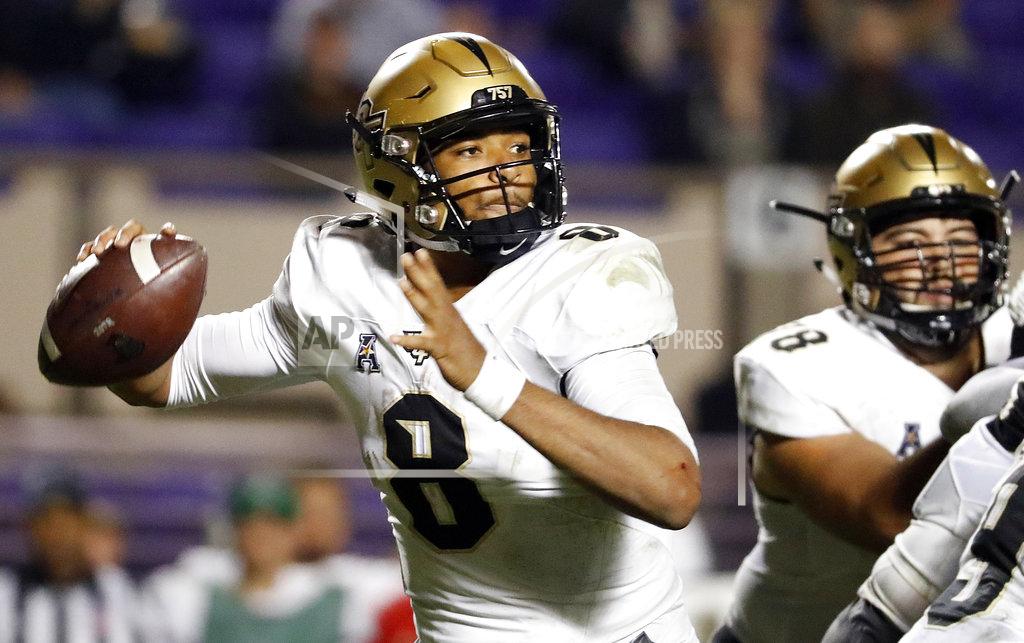 Karl B Deblaker Central Florida's Darriel Mack Jr. (8) prepares to throw the ball during the second half of an NCAA college football game against East Carolina in Greenville, N.C., Saturday, Oct. 20, 2018. (AP Photo/Karl B DeBlaker)