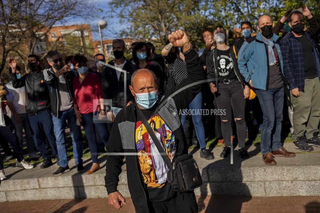 Bernat Armangue Left-wing protesters gather against a campaign event of the far-right Vox party in Madrid, Spain, Wednesday, April 7, 2021. Spanish police had to use batons on Wednesday to keep protesters away from supporters of the far-right Vox party at a campaign rally in Madrid. Scuffles started when the national leader of Vox, Santiago Abascal, approached a crowd which had gathered to protest the party rally in Madrid's working-class Vallecas neighborhood, a traditional left-wing bastion. Riot peace charged several hundred protesters to keep them away from Abascal and other members of his party campaigning for May 4 regional elections in the area including Spain's capital. (AP Photo/Bernat Armangue)