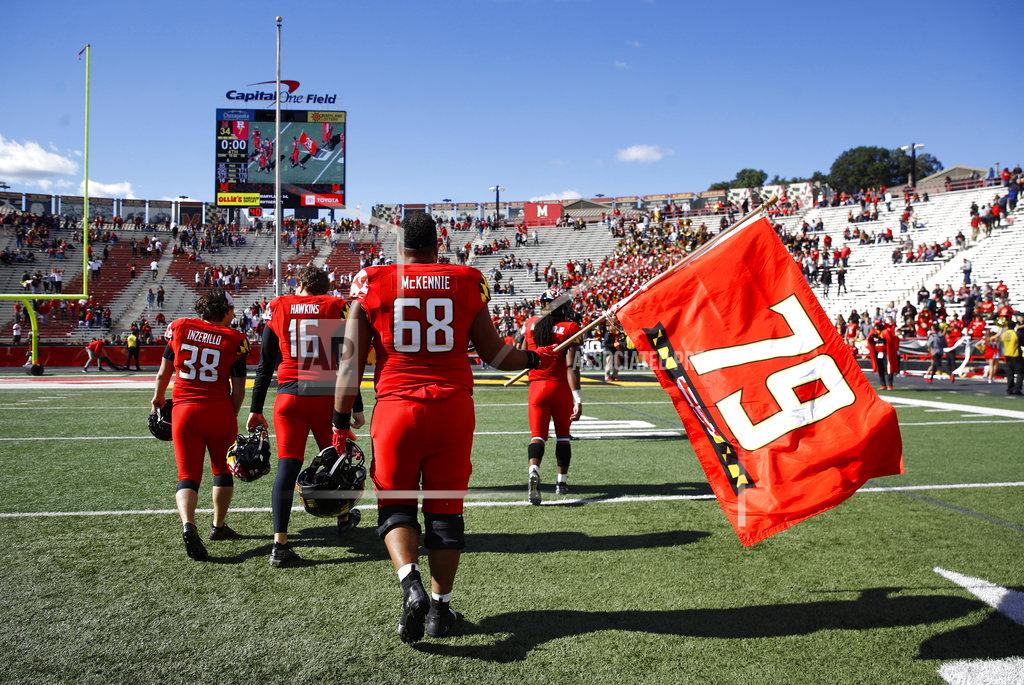 Patrick Semansky Maryland offensive lineman Ellis McKennie waves a flag in remembrance of teammate Jordan McNair, who died after collapsing on a practice field during a spring practice, after an NCAA college football game against Rutgers, Saturday, Oct. 13, 2018, in College Park, Md. Maryland won 34-7. (AP Photo/Patrick Semansky)