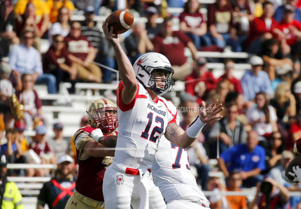 Mary Schwalm Richmond quarterback Joe Mancuso (12) looks to pass during the first half of an NCAA college football game against Boston College, Saturday, Sept. 7, 2019, in Boston. (AP Photo/Mary Schwalm)