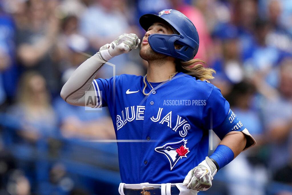 Frank Gunn Toronto Blue Jays' Bo Bichette (11) celebrates his solo home run against the Cincinnati Reds during the fourth inning of a baseball game in Toronto, Saturday, May 21, 2022. (Frank Gunn/The Canadian Press via AP)