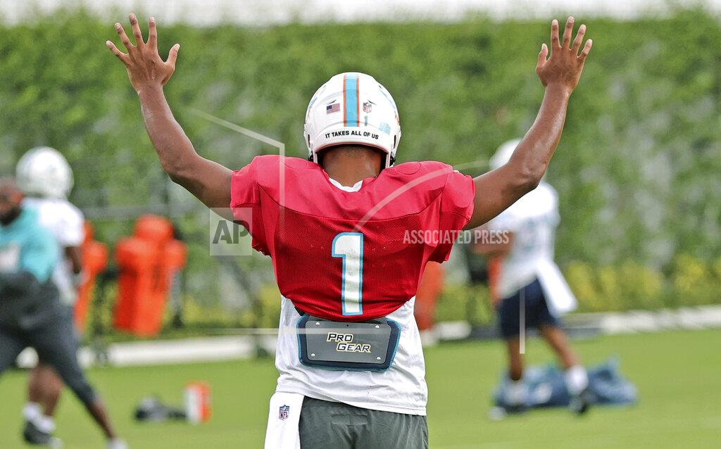 David Santiago Miami Dolphins quarterback Tua Tagovailoa (1) reacts after a play during practice at Baptist Health Training Complex in Hard Rock Stadium on Wednesday, October 13, 2021 in Miami Gardens, Florida, in preparation for their game against the Jacksonville Jaguars at Tottenham Hotspur Stadium in London on Sunday, October 17.(David Santiago/Miami Herald via AP)