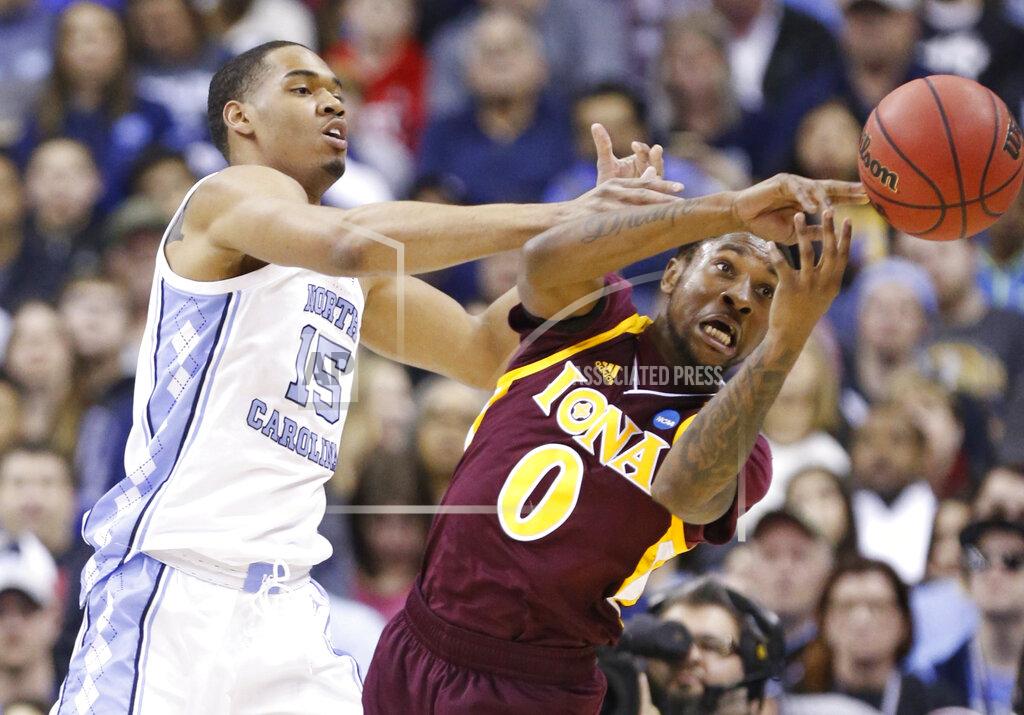 Paul Vernon North Carolina's Garrison Brooks (15) and Iona's Rickey McGill (0) battle for the ball in the first half during a first round men's college basketball game in the NCAA Tournament in Columbus, Ohio, Friday, March 22, 2019. (AP Photo/Paul Vernon)