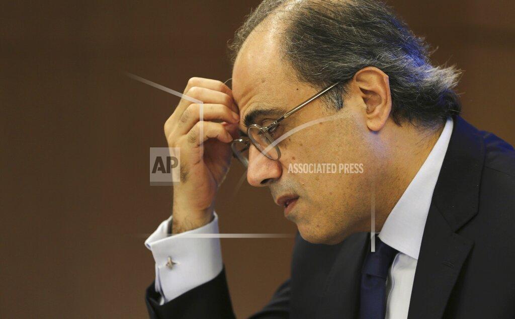 FILE - In this Nov.13, 2018 file photo, Jihad Azour, the IMF's director of the Middle East and Central Asia Department reacts during his press conference in Dubai, United Arab Emirates. The coronavirus pandemic is hitting countries in the Middle East in wildly different ways, but nearly all are in the throes of an economic recession this year and all but two, Lebanon and Oman are expected to see some level of economic growth next year, according to the latest report published by the International Monetary Fund on Monday, Oct. 19, 2020. (AP Photo/Kamran Jebreili, File)
