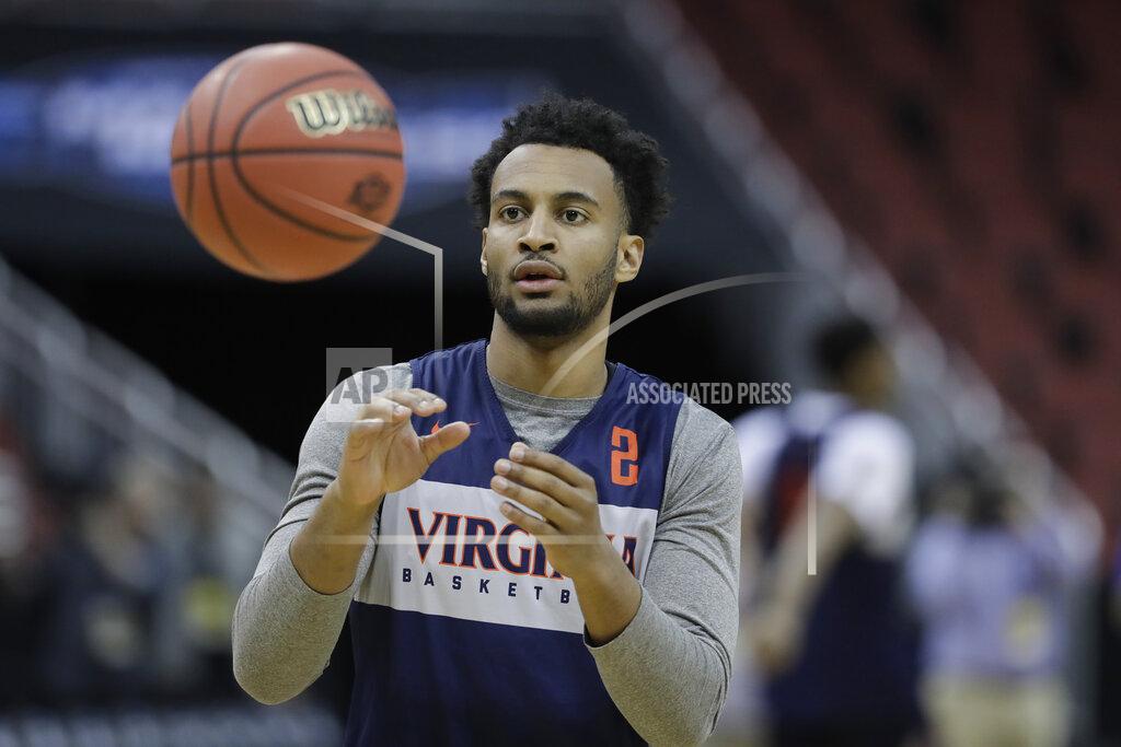 Darron Cummings Virginia's Braxton Key catches a pass during practice at the NCAA men's college basketball tournament, Wednesday, March 27, 2019, in Louisville, Ky. (AP Photo/Darron Cummings)