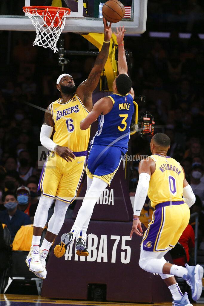 Ringo H.W. Chiu Los Angeles Lakers forward LeBron James (6) blocks a shot by Golden State Warriors guard Jordan Poole (3) during the first half of an NBA basketball game in Los Angeles, Tuesday, Oct. 19, 2021. (AP Photo/Ringo H.W. Chiu)