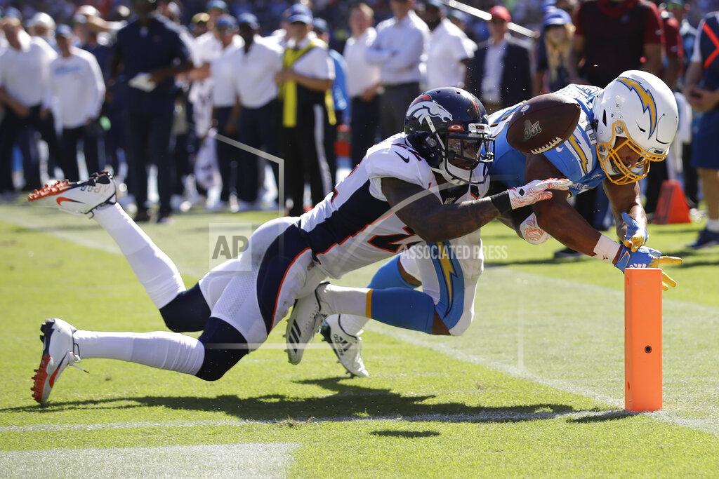Marcio Jose Sanchez Denver Broncos defensive back Kareem Jackson, left, forces a fumble by Los Angeles Chargers running back Austin Ekeler at the goal line during the first half of an NFL football game Sunday, Oct. 6, 2019, in Carson, Calif. (AP Photo/Marcio Jose Sanchez)