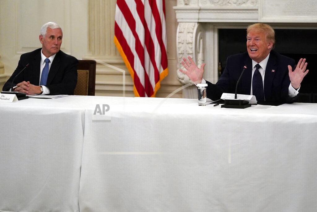 President Donald Trump tells reporters that he is taking zinc and hydroxychloroquine during a meeting with restaurant industry executives about the coronavirus response, in the State Dining Room of the White House, Monday, May 18, 2020, in Washington. Vice President Mike Pence listens as left. (AP Photo/Evan Vucci)