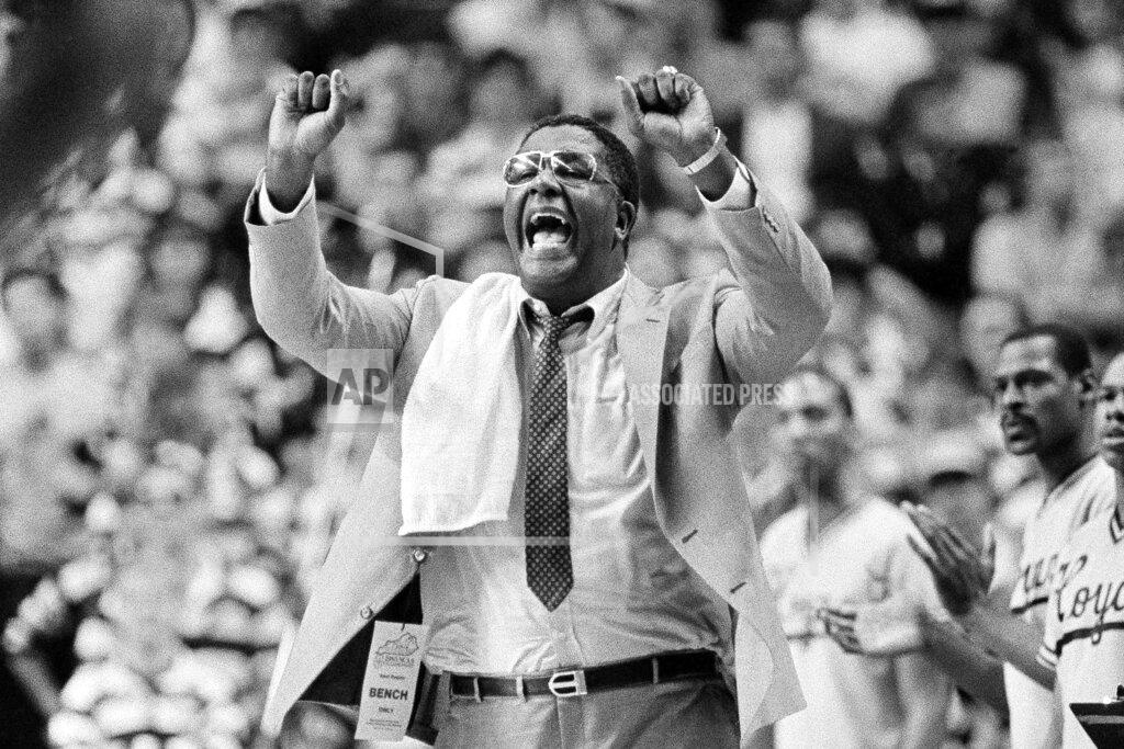 Anonymous FILE - In this March 30, 1985, file photo, Georgetown coach John Thompson shouts to the floor during the Hova's NCAA semifinal game against St. John's at Rudo Arena in Lexington, Ky. John Thompson, the imposing Hall of Famer who turned Georgetown into a “Hoya Paranoia” powerhouse and became the first Black coach to lead a team to the NCAA men’s basketball championship, has died. He was 78 His death was announced in a family statement Monday., Aug. 31, 2020. No details were disclosed. (AP Photo/File)