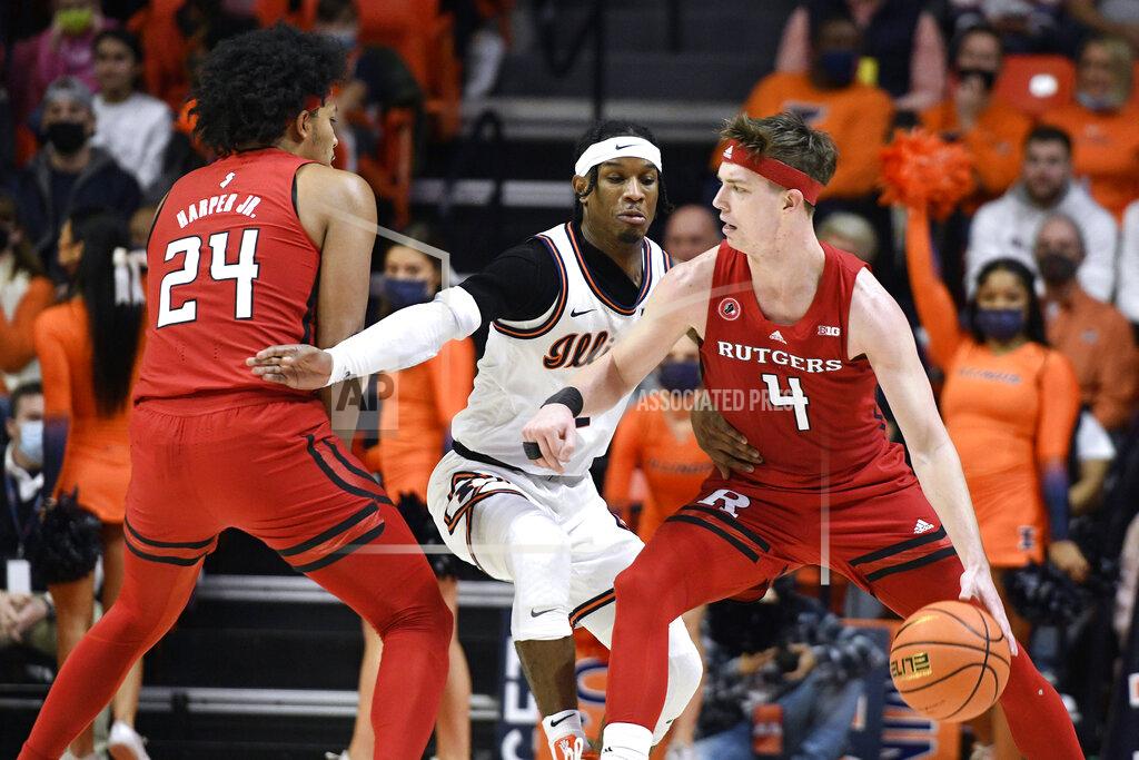 Michael Allio Rutgers' Paul Mulcahy (4) dribbles the ball as Ron Harper Jr. (24) sets a screen on Illinois' Trent Frazier during the first half of an NCAA college basketball game Friday, Dec. 3, 2021, in Champaign, Ill. (AP Photo/Michael Allio)