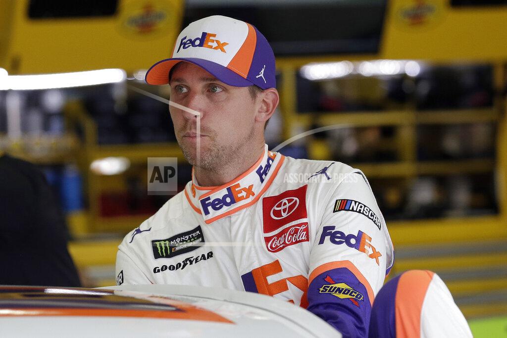 Gerry Broome FILE - In this Sept. 28, 2019, file photo, Denny Hamlin climbs into is car to practice for the NASCAR Cup Series auto race at Charlotte Motor Speedway in Concord, N.C. Hamlin thought he was the favorite to win NASCAR’s championship but now finds himself in danger of not even making it to the title round. Chase Elliott is fairly certain he’s backed himself into such a hole that his only chance at a championship is by winning Sunday’s penultimate race of the season. (AP Photo/Gerry Broome, File)