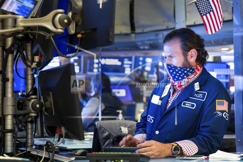 Nicole Pereira Specialist Michael Pistillo works at the New York Stock Exchange on Monday, Nov. 23, 2020. Stocks rose in early trading Monday after investors received several pieces of encouraging news on COVID-19 vaccines and treatments, tempering concerns over rising virus cases and business restrictions. (Nicole Pereira/New York Stock Exchange via AP)