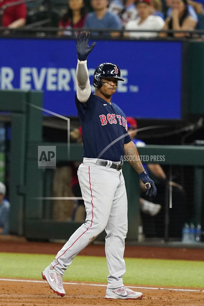 Lm Otero Boston Red Sox's Rafael Devers motions to the team's dugout after hitting an RBI single against the Texas Rangers during the third inning of a baseball game in Arlington, Texas, Friday, May 13, 2022. (AP Photo/LM Otero)