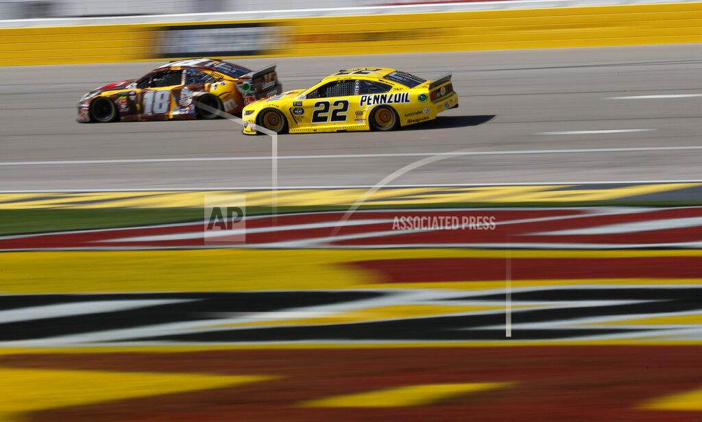John Locher Kyle Busch (18) and Joey Logano (22) drive during a NASCAR Cup Series auto race at the Las Vegas Motor Speedway, Sunday, March 3, 2019, in Las Vegas. (AP Photo/John Locher)