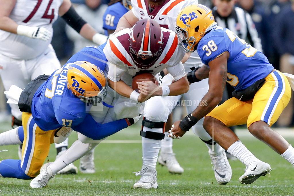 Keith Srakocic Virginia Tech quarterback Ryan Willis (5) is sacked by Pittsburgh defensive lineman Rashad Weaver (17) and linebacker Cam Bright (38) in the first quarter of an NCAA football game, Saturday, Nov. 10, 2018, in Pittsburgh. (AP Photo/Keith Srakocic)